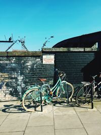 Cars parked against clear blue sky
