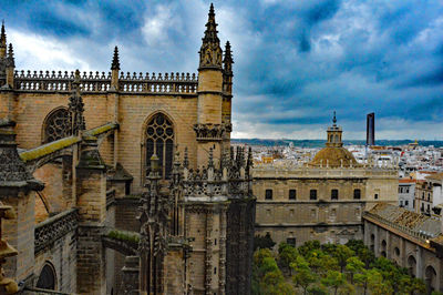 Low angle view of church against cloudy sky