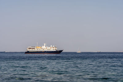 Ship in sea against clear sky