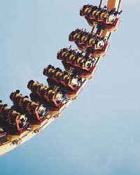 Low angle view of carousel against clear sky