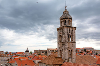 View of bell tower against cloudy sky