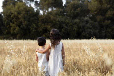 Full length of woman standing on field