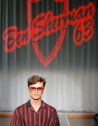 Portrait of a young man standing outdoors