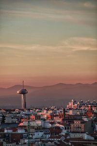 High angle view of buildings against sky at sunset