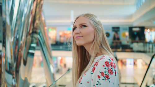 Woman looking away in shopping mall