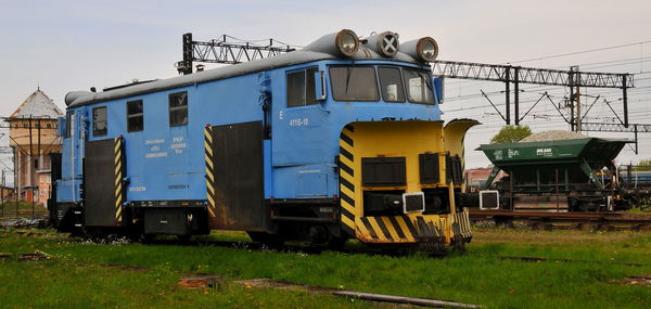 Train on railroad track against sky