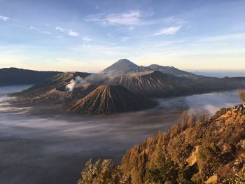 View of volcanic landscape against cloudy sky