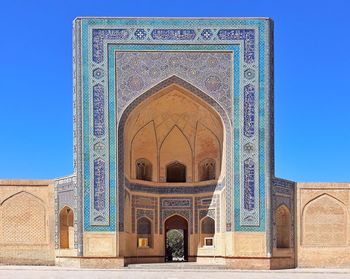 Exterior of temple against clear blue sky