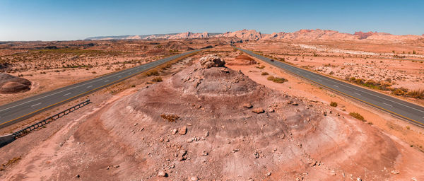 Panoramic image of a lonely, seemingly endless road in the desert of southern arizona.