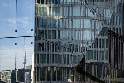 Reflection of buildings on glass window