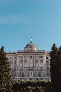 Low angle view of building against blue sky