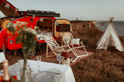 Cozy camping on the background of the sea, traveling by car, traveling with a camper