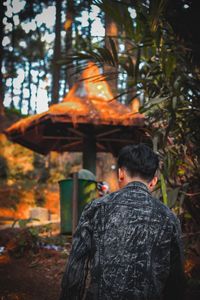 Rear view of man standing in park