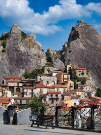 Buildings in town against sky