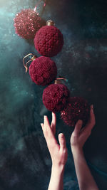 Close-up of hand holding strawberry