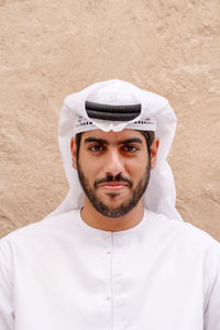 Portrait of young man wearing traditional clothing 