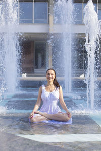 Portrait of a woman sitting on water