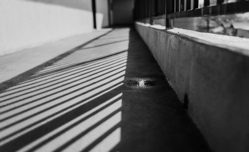 Close-up of metal railing against wall