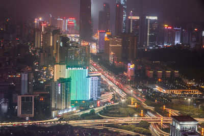 High angle view of illuminated city buildings at night