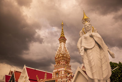 Low angle view of statue against cloudy sky