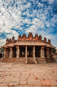 Old temple against cloudy sky