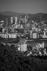 High angle view of buildings and mountains against sky