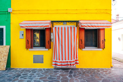 Closed yellow door of building