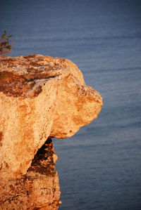 Close-up of rock formation in sea