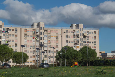 Buildings in city against sky