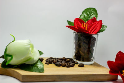 Close-up of red rose on table