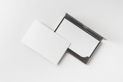 High angle view of paper against white background