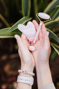 Close-up of woman hand holding plant