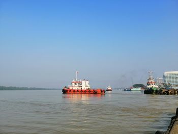 Sailing.... tugboat  doing their duty...