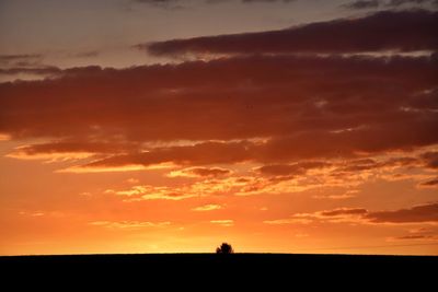 Scenic view of silhouette landscape against sky during sunset