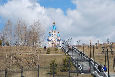 View of church and building against sky