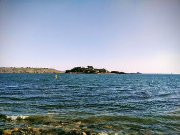 Scenic view of sea against clear sky