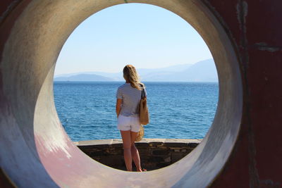 Rear view of woman looking at sea