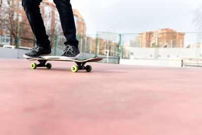 Low section of person skateboarding