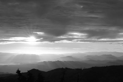 Scenic view of silhouette mountains against sky