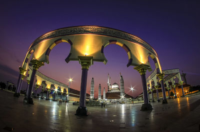 Illuminated street light at central java greates mosque against sky at night 