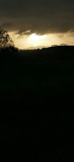 Scenic view of silhouette landscape against sky during sunset