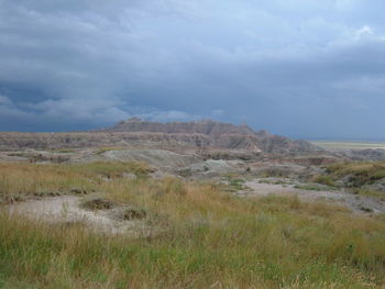 Scenic view of mountains against cloudy sky