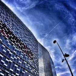 Low angle view of building against cloudy sky