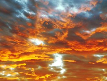 Low angle view of dramatic sky during sunset