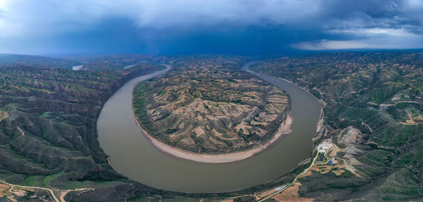 High angle view of landscape against cloudy sky