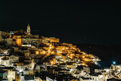 High angle view of illuminated buildings in city at night