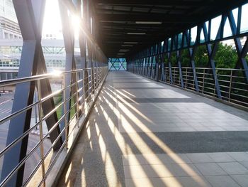 Empty footbridge with shadow on footpath