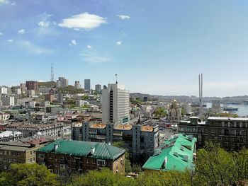 High angle view of buildings in city against sky