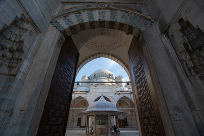 Main door, courtyard and dome of sehzadebasi mosque in istanbul