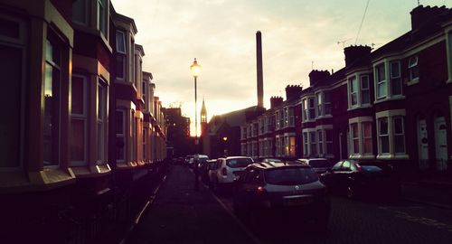 Cars parked on road in city
